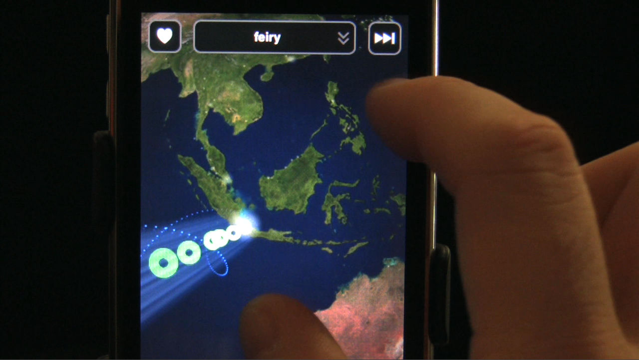 a globe with 
double helix visualizes people around the world playing Ocarina on their iPhones